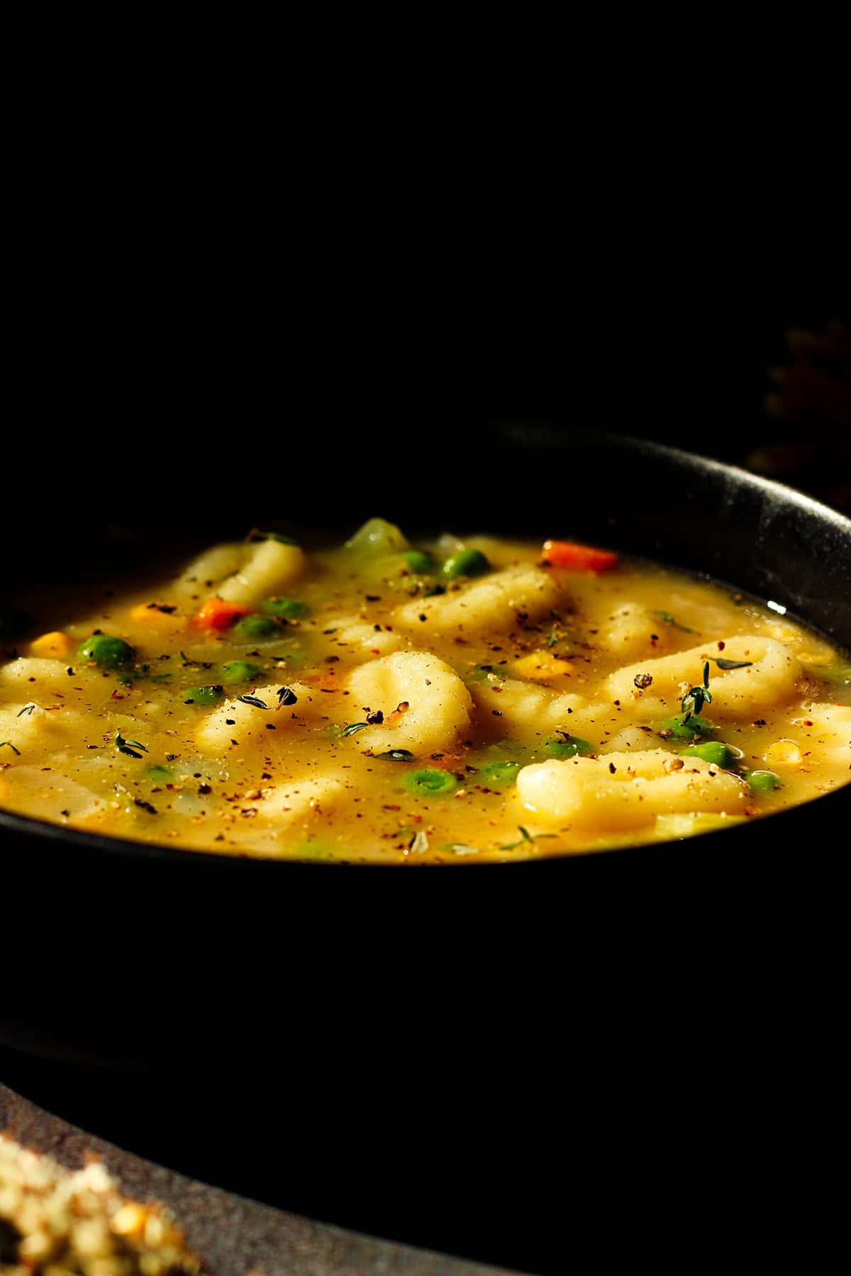 a hot bowl of vegetable dumpling soup