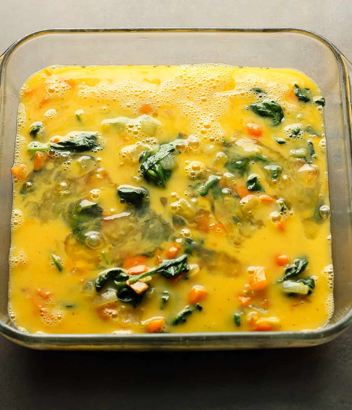 eggs and egg whites whisked and added to vegetables for baking