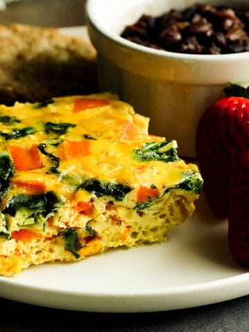 baked eggs with egg whites served with chicken sausage fruit and beans