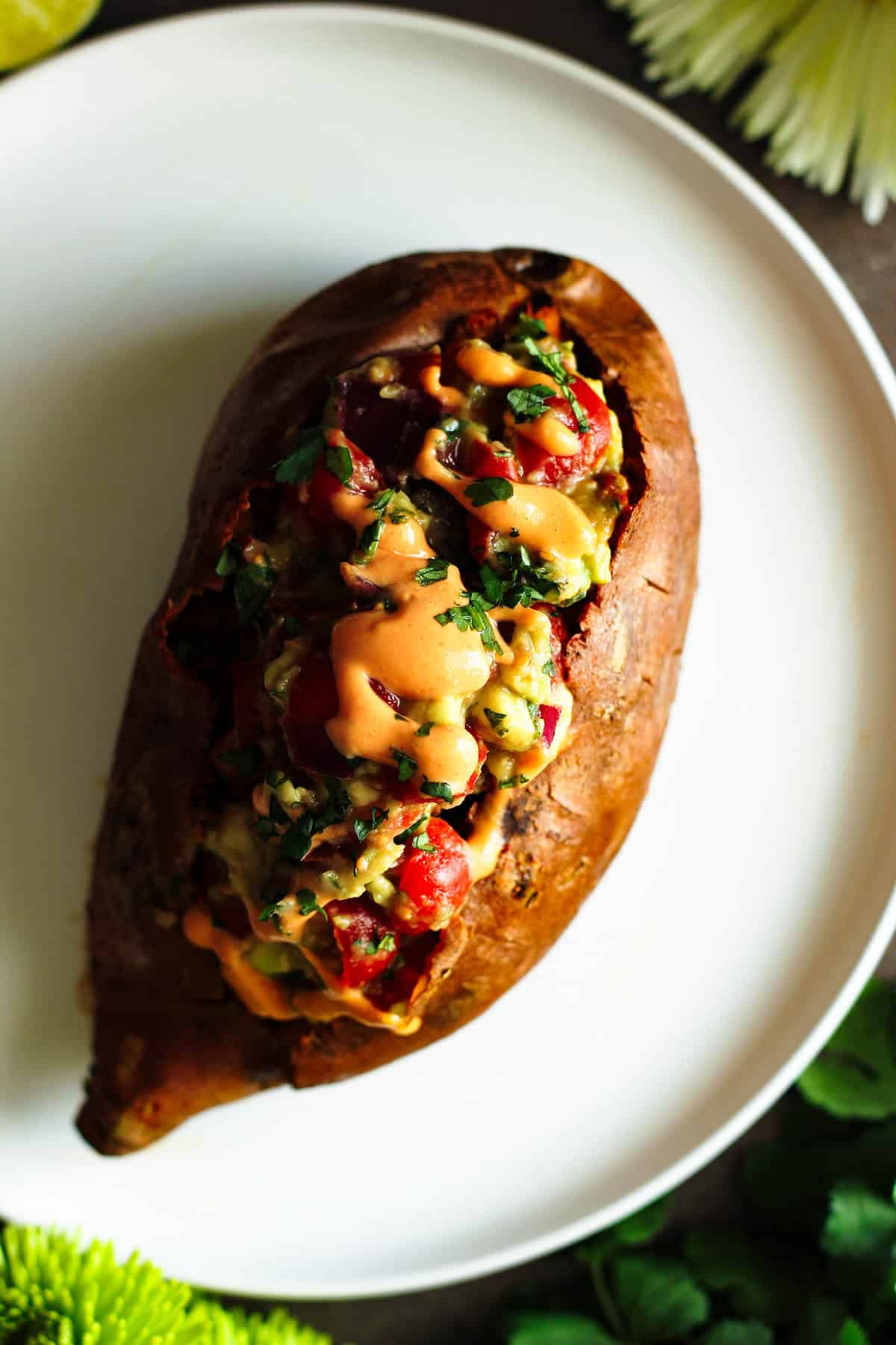 creamy chipotle lime sauce on a stuffed baked sweet potato