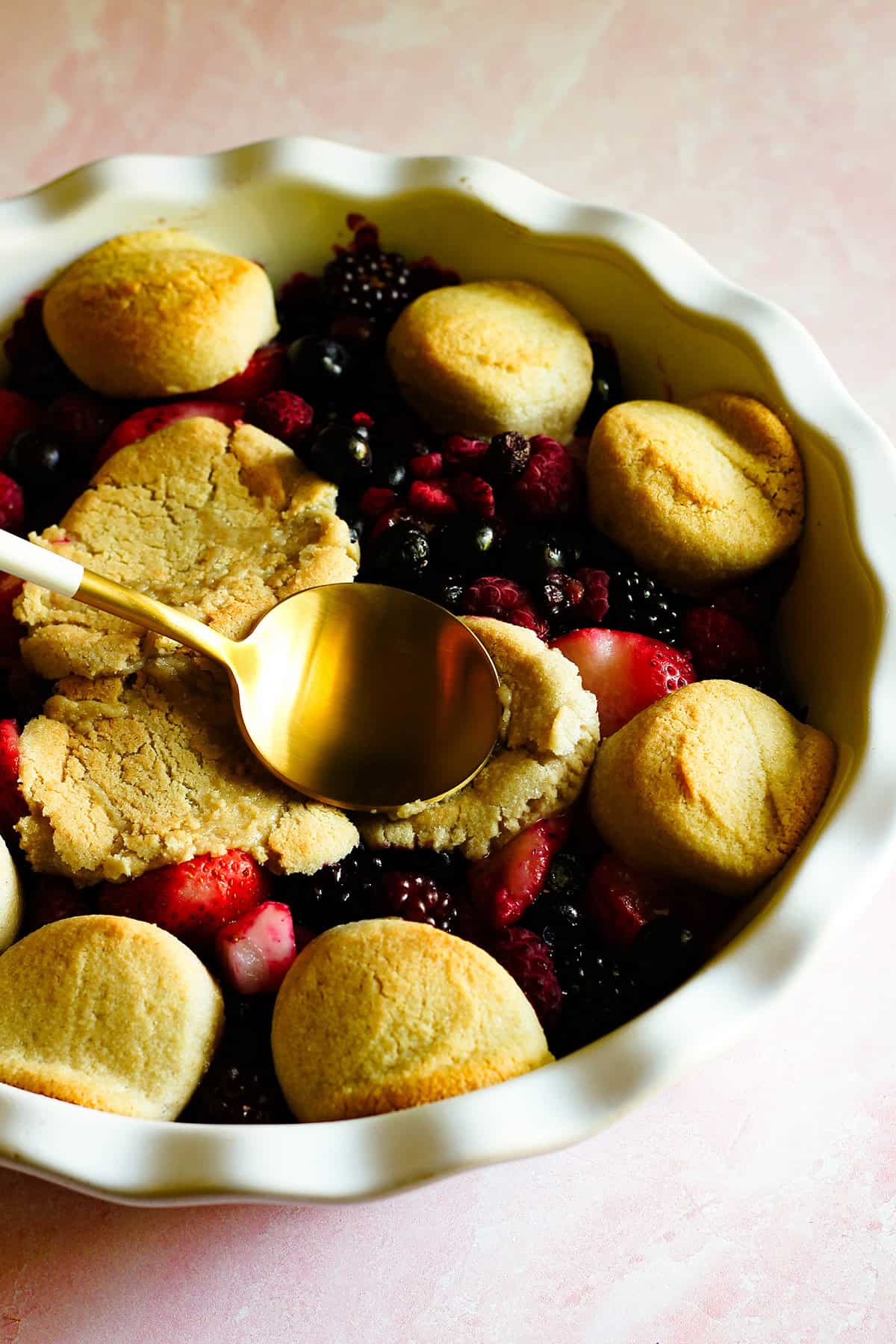 gently pressing the cookie dough down with a spoon